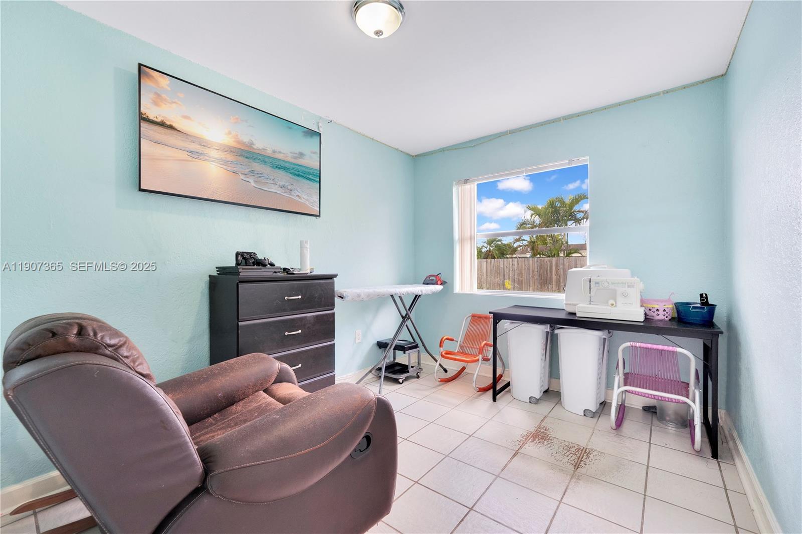 18922 Southwest 120th Court Miami, FL 33177 - Photo 8 of 29 a work room with furniture and a flat screen tv