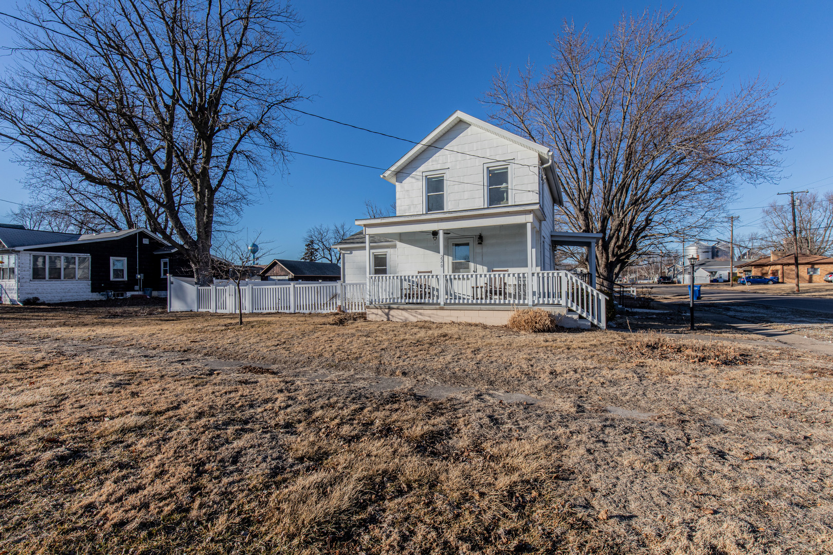 220 2nd Street Wyanet, IL 61379 - Photo 2 of 27 a view of a house with a yard covered in snow