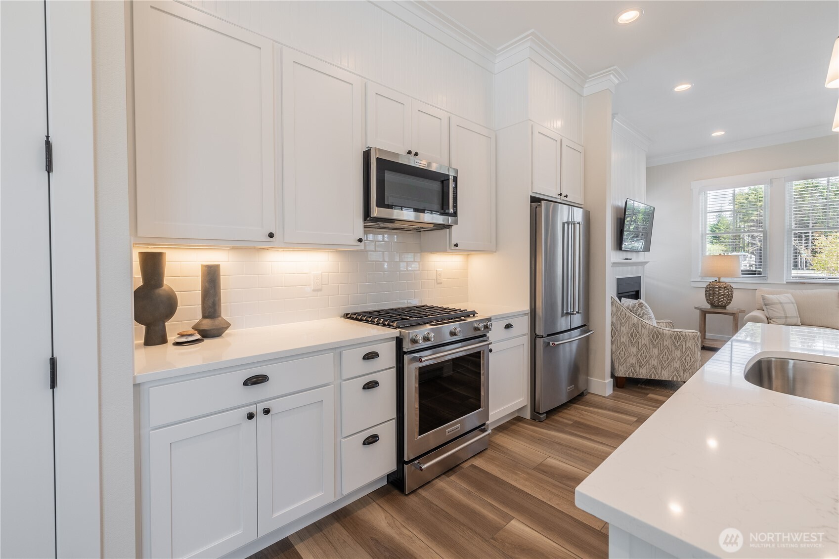 441 East Compass Street Pacific Beach, WA 98571 - Photo 11 of 26 a kitchen with stainless steel appliances granite countertop a sink stove and refrigerator
