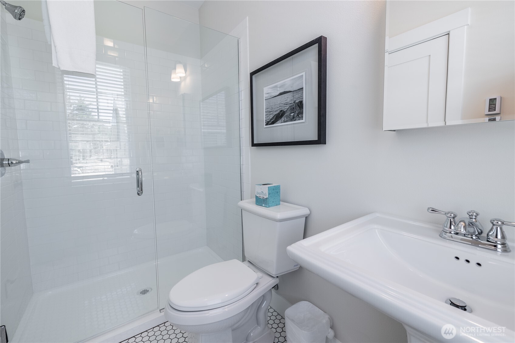 441 East Compass Street Pacific Beach, WA 98571 - Photo 18 of 26 a white toilet sitting next to a bathroom sink