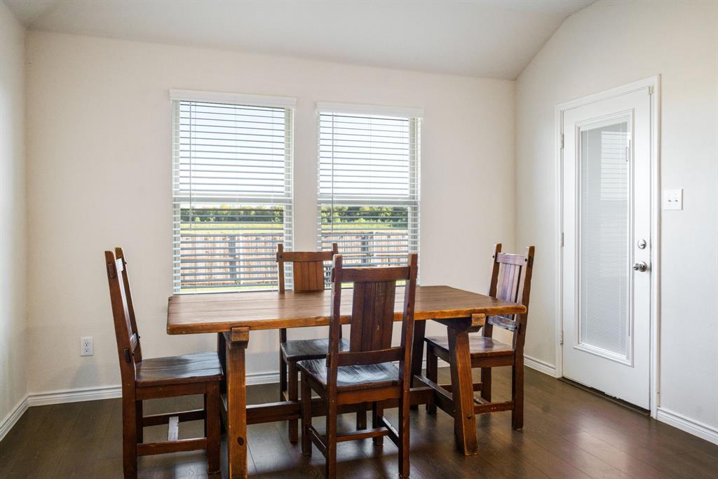653 Bunker Hill Road Houston, TX 77024 - Photo 12 of 36 Dining space featuring dark wood finished floors and lofted ceiling