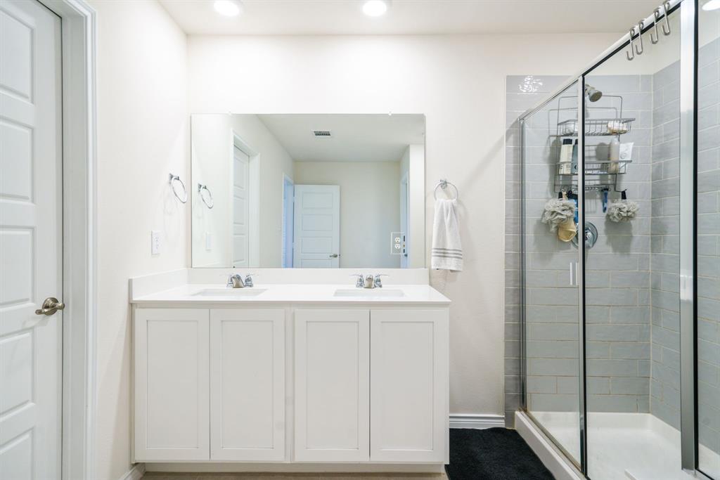 653 Bunker Hill Road Houston, TX 77024 - Photo 17 of 36 Full bath featuring double vanity and a stall shower