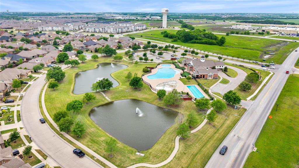 653 Bunker Hill Road Fate, TX 75189 - Photo 26 of 36 Aerial view of community entrance showing ponds, pools, and amenity center.