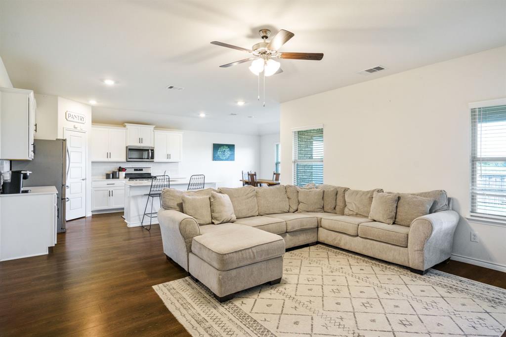 653 Bunker Hill Road Houston, TX 77024 - Photo 9 of 36 Living room with dark wood finished floors, a ceiling fan, healthy amount of natural light, and recessed lighting
