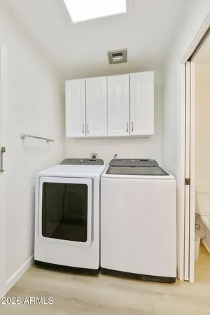a utility room with washer and dryer