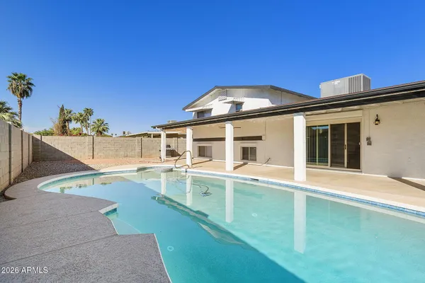 a view of a house with a swimming pool