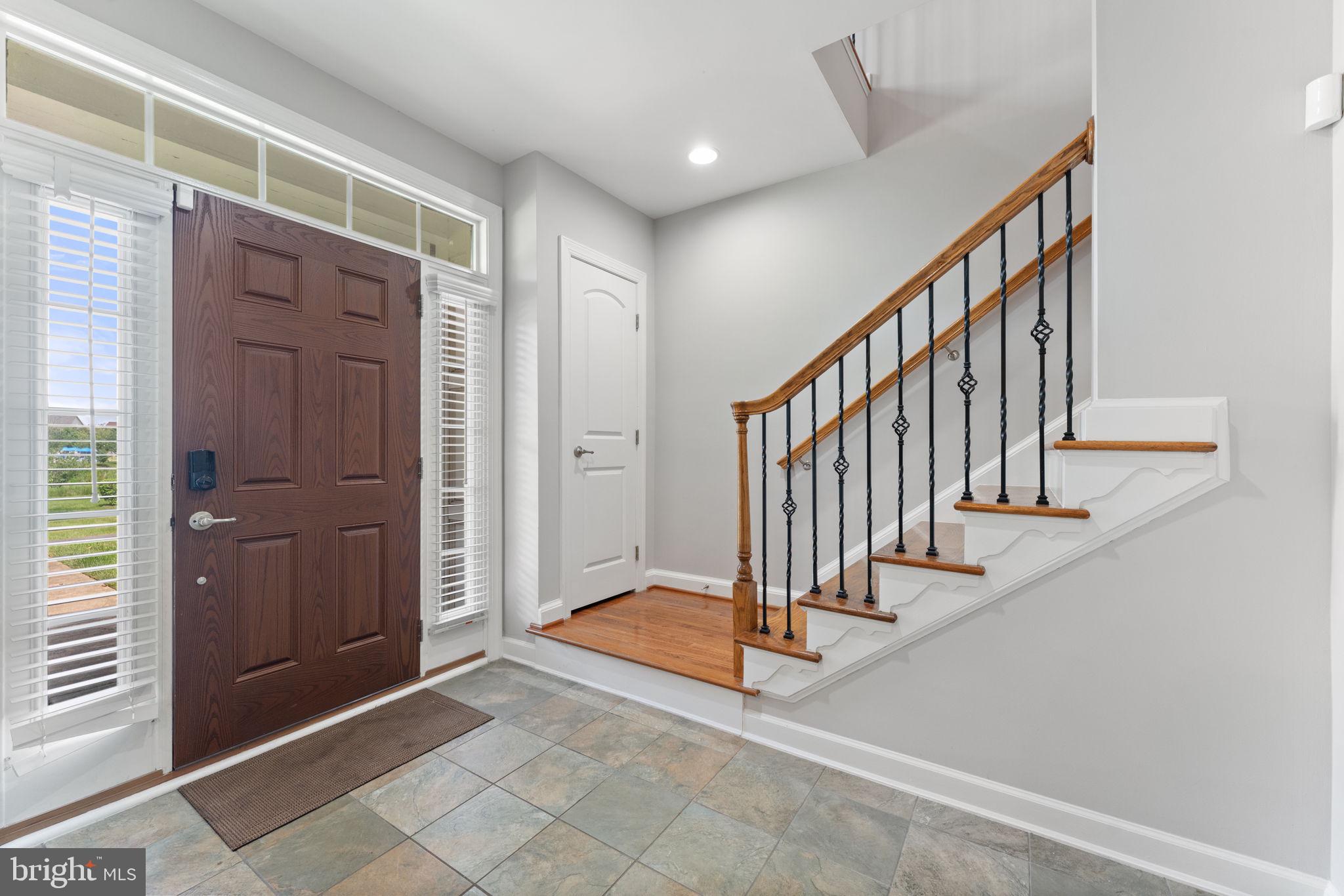 42524 Rowderbury Square Chantilly, VA 20152 - Photo 15 of 73 a view of an entryway with staircase