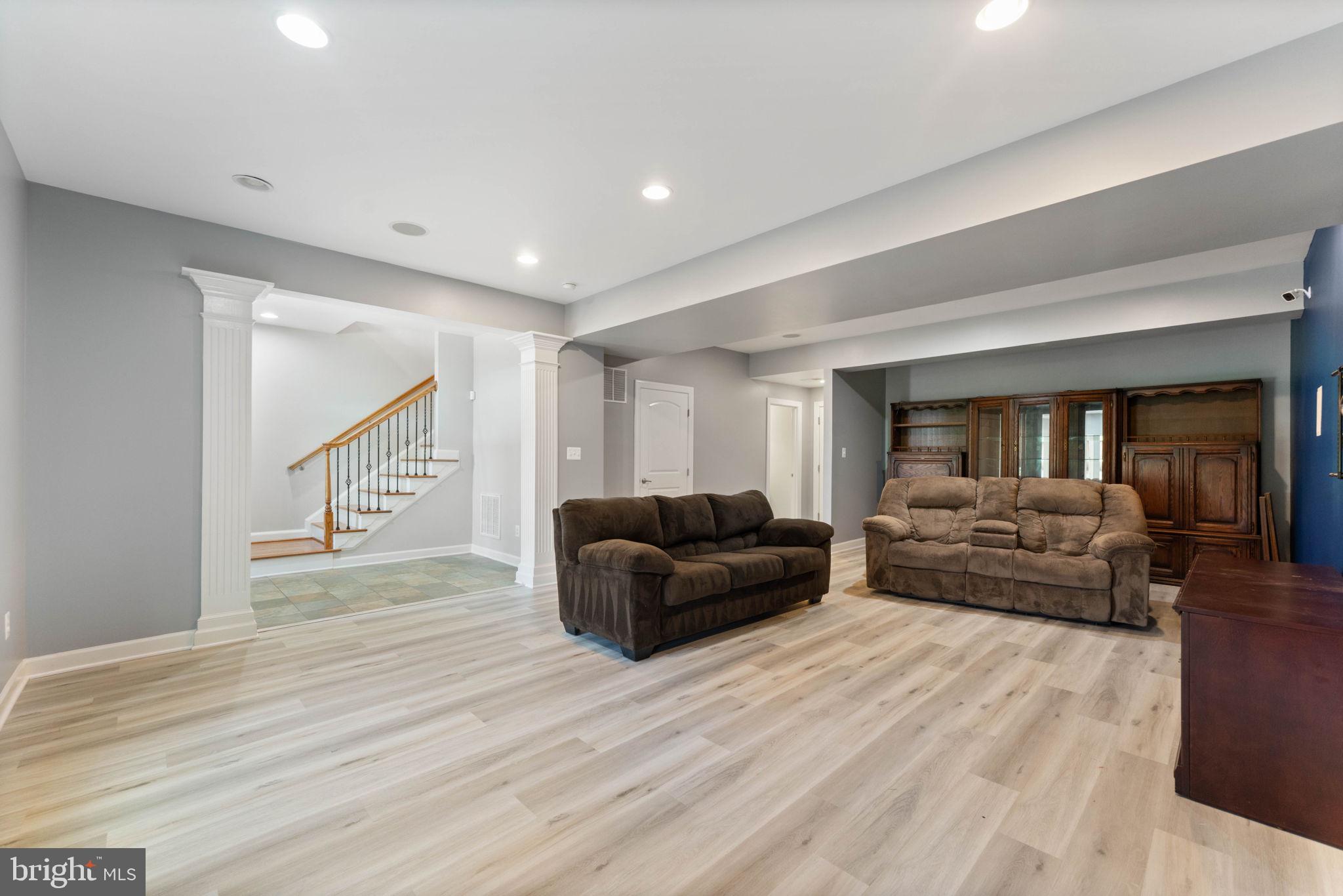 42524 Rowderbury Square Chantilly, VA 20152 - Photo 17 of 73 a living room with furniture and a wooden floor