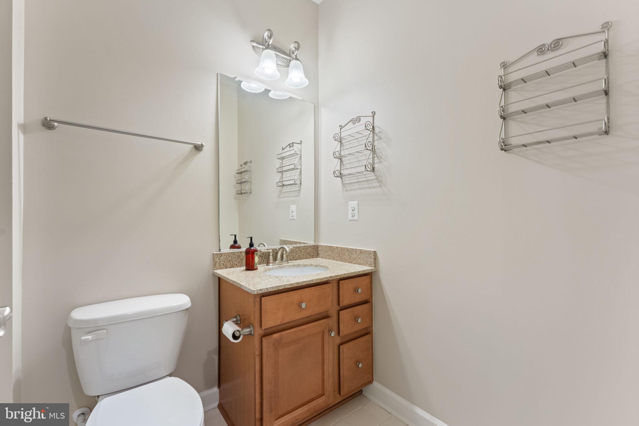 42524 Rowderbury Square Chantilly, VA 20152 - Photo 19 of 73 a bathroom with a toilet sink and mirror