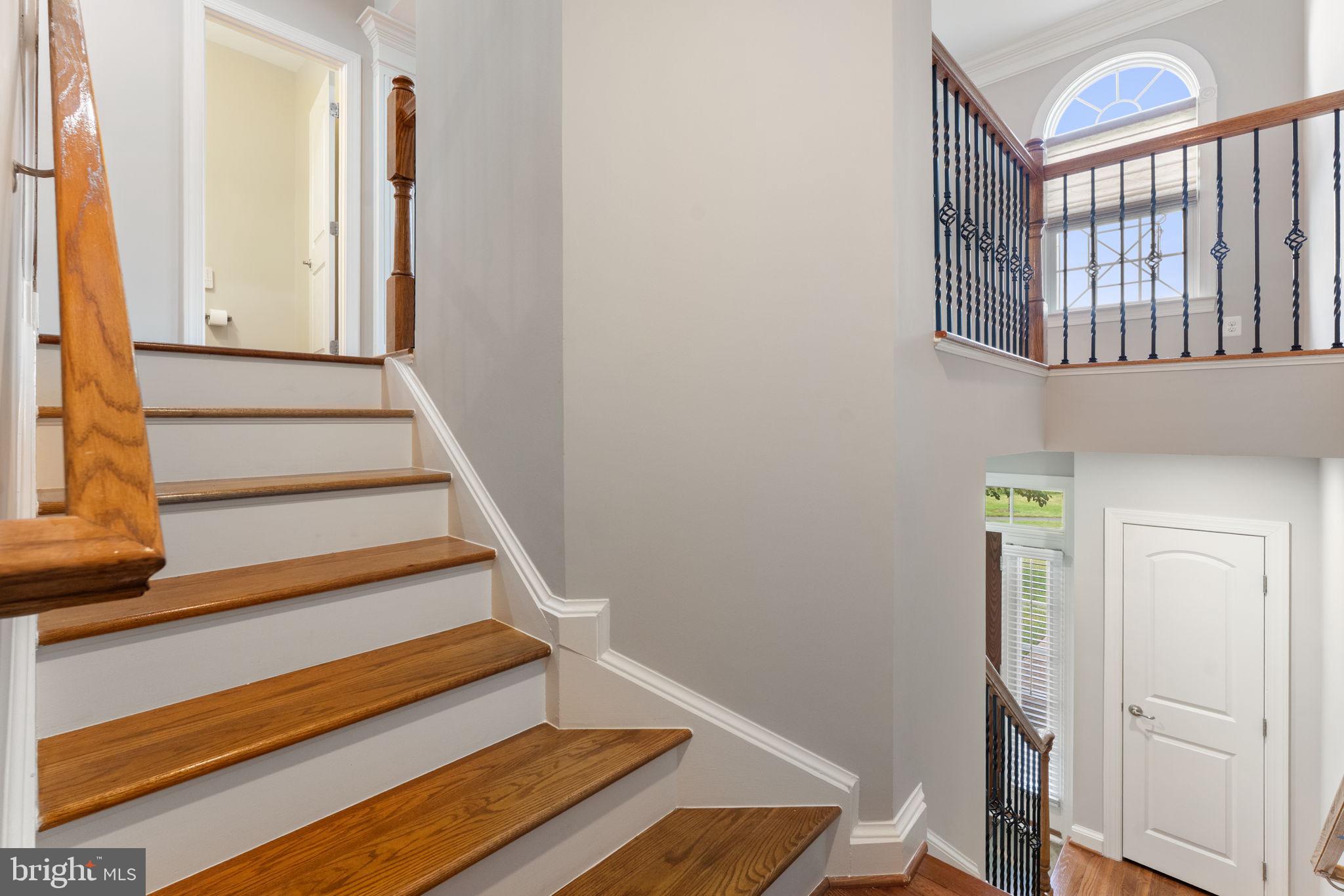 42524 Rowderbury Square Chantilly, VA 20152 - Photo 21 of 73 a view of entryway with wooden floor and stairs