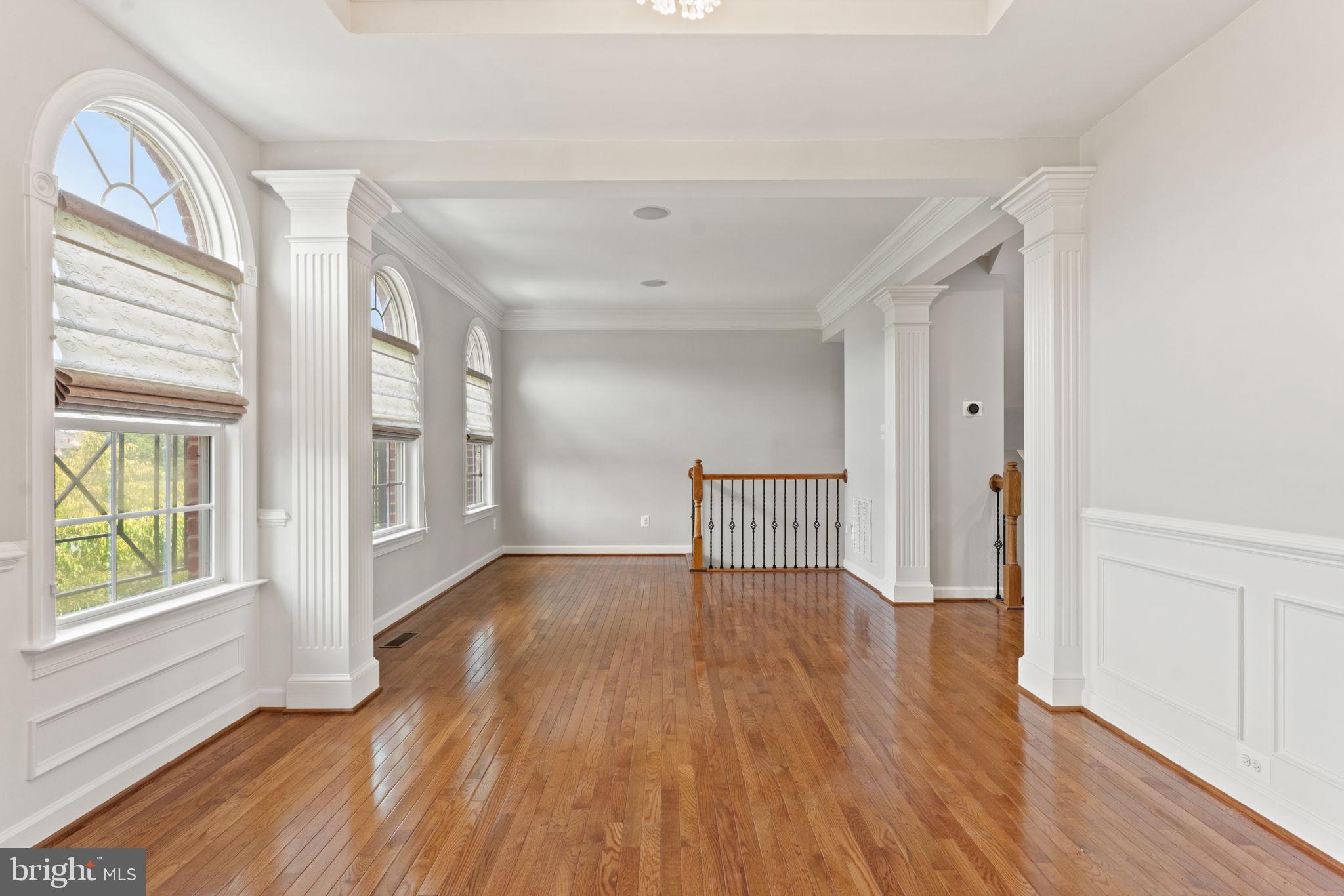 42524 Rowderbury Square Chantilly, VA 20152 - Photo 24 of 73 a view of an empty room with wooden floor and a window