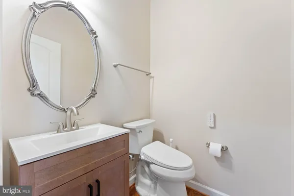 a large kitchen with stainless steel appliances granite countertop a stove and a sink