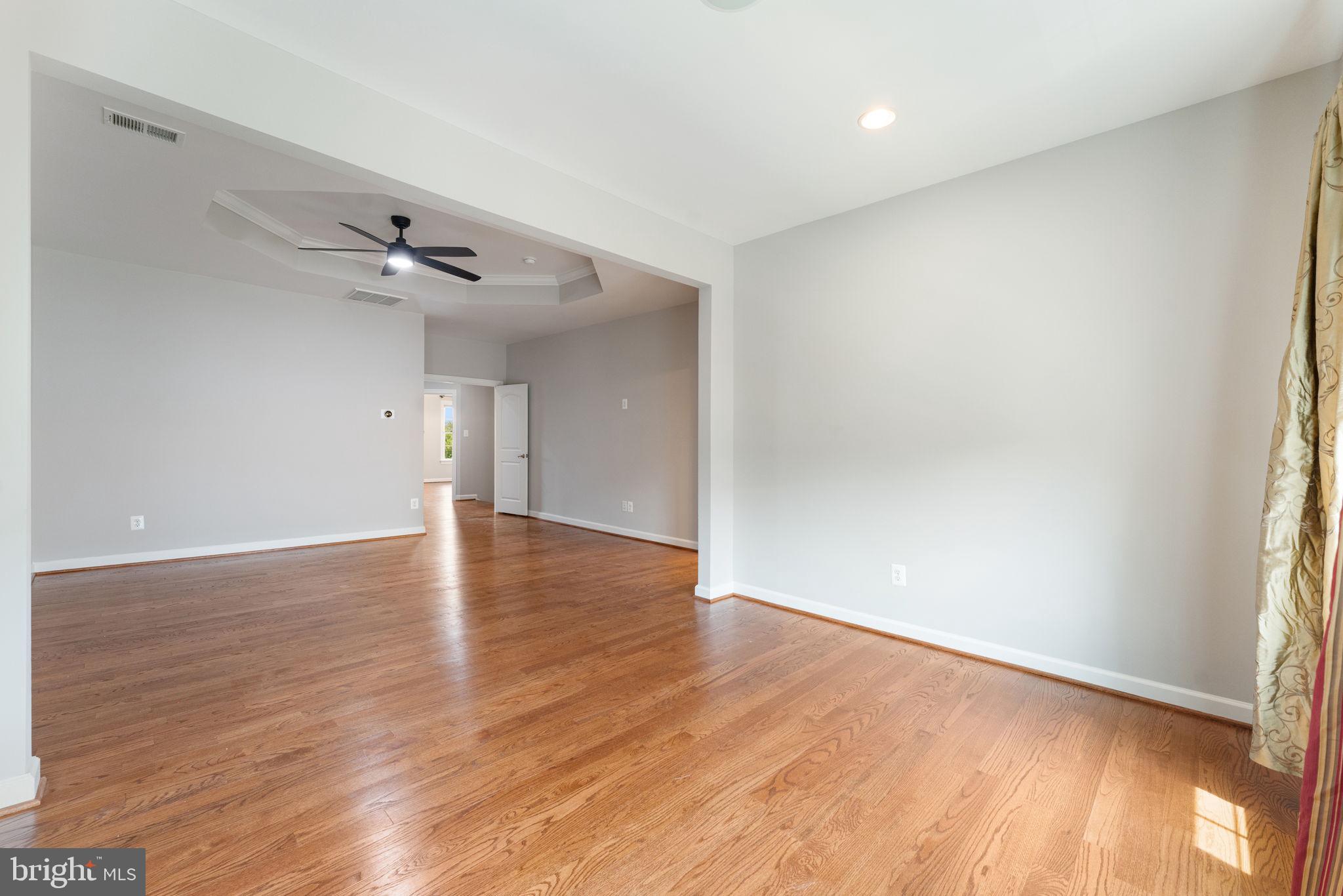 42524 Rowderbury Square Chantilly, VA 20152 - Photo 51 of 73 a view of an empty room with wooden floor