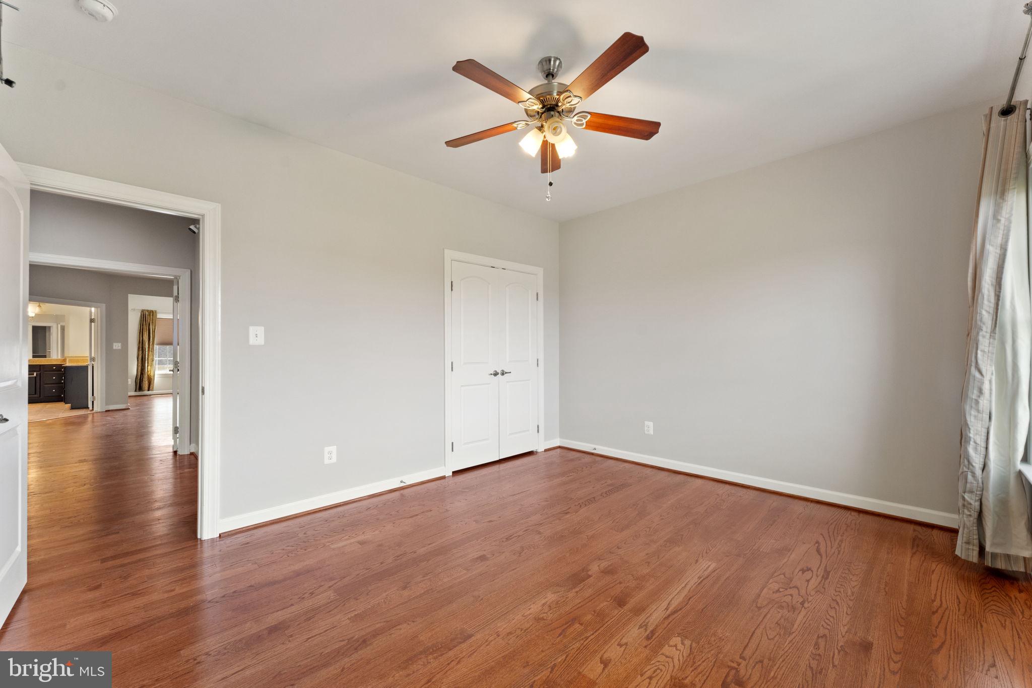42524 Rowderbury Square Chantilly, VA 20152 - Photo 63 of 73 wooden floor in an empty room with a window