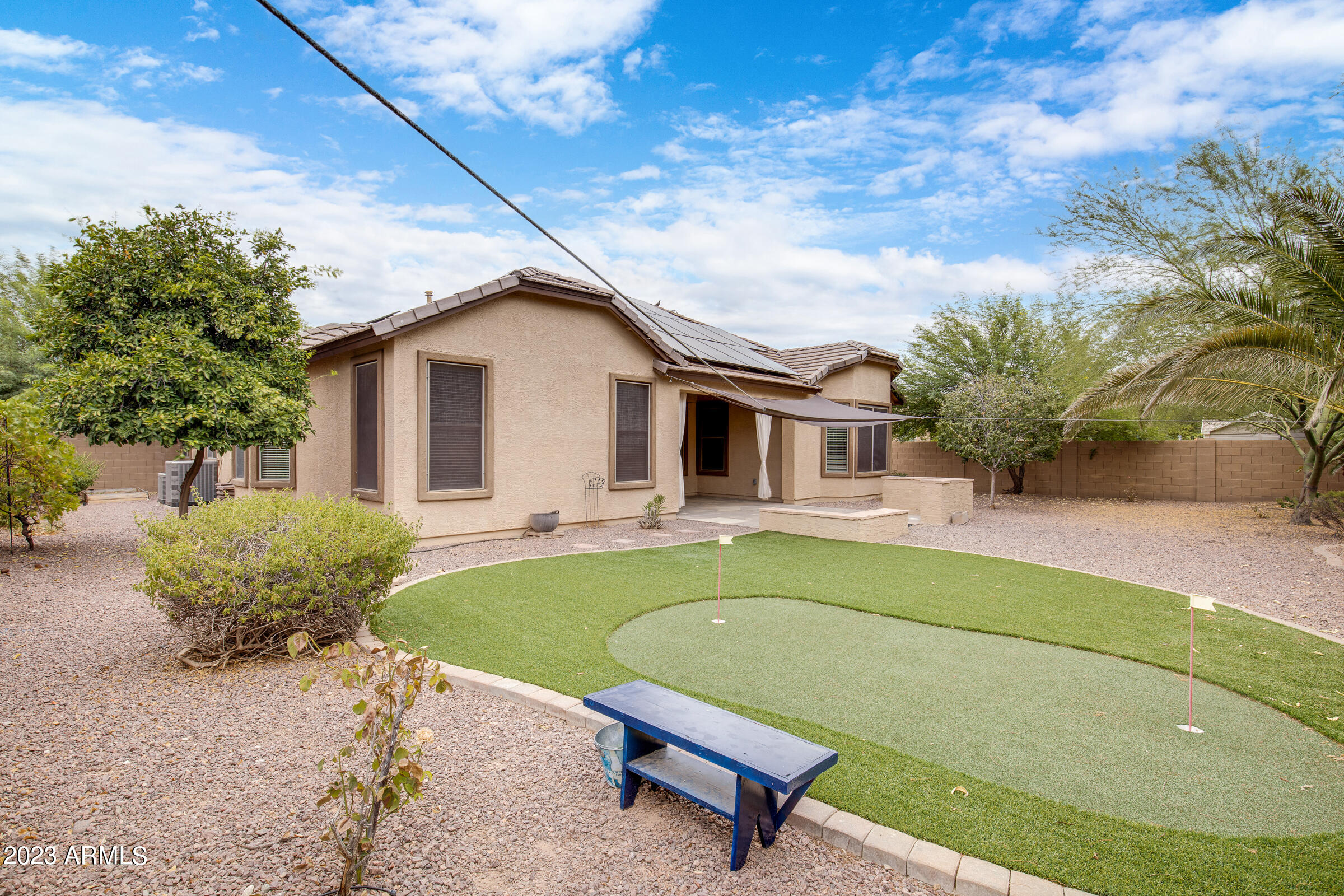 14261 West Wethersfield Road Surprise, AZ 85379 - Photo 3 of 32 Backyard-Putting Green