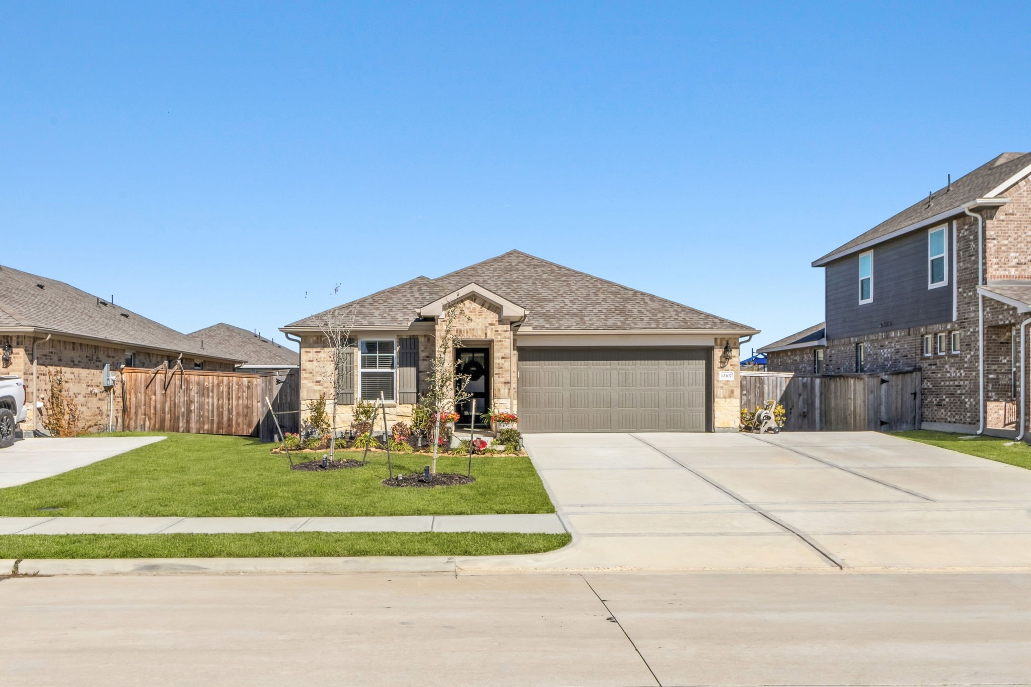 a front view of a house with a yard