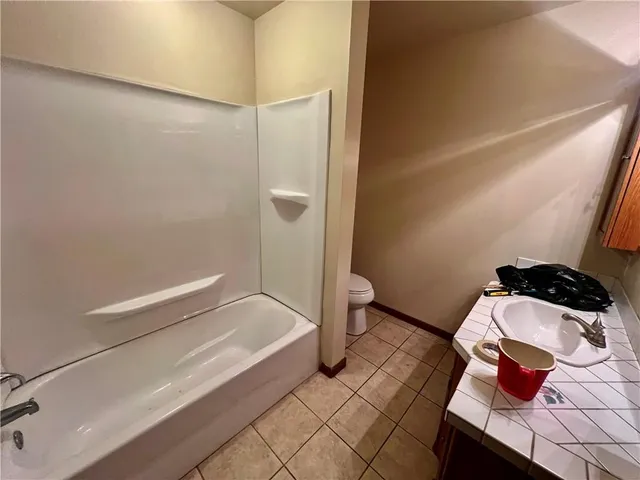 a bathroom with a sink and toilet