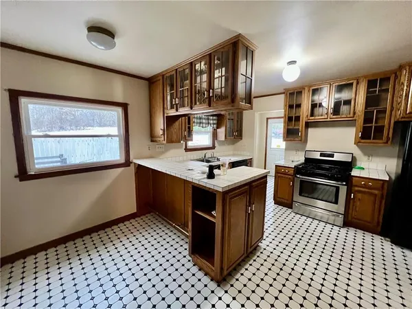 a kitchen with a cabinets and appliances