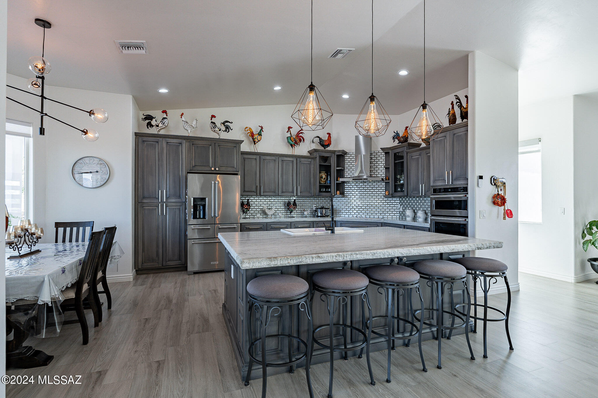 176 Avenida Ostion Rio Rico, AZ 85648 - Photo 16 of 48 a large kitchen with a table and chairs