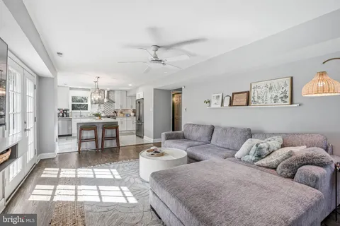 a view of a livingroom with a fireplace and window
