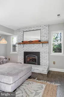 a kitchen with kitchen island a stove a table and chairs in it