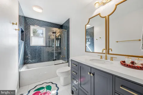 a bathroom with a sink a vanity and a mirror