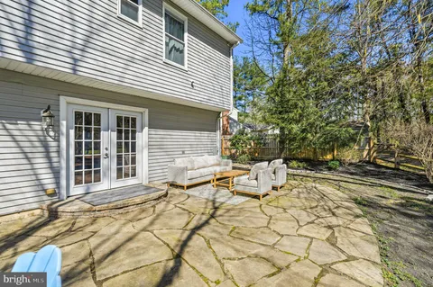 a view of a house with wooden fence