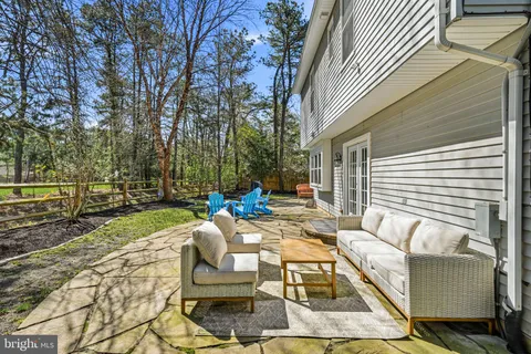 a backyard of a house with barbeque oven