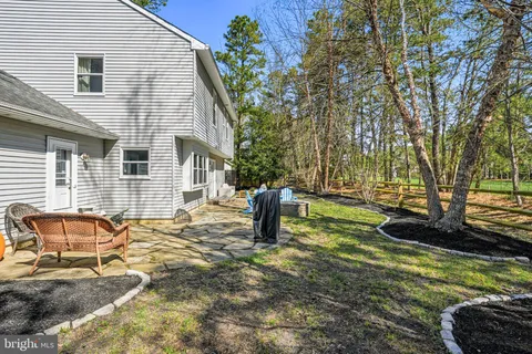 a green field with lots of trees