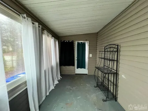 a view of entryway with wooden walls