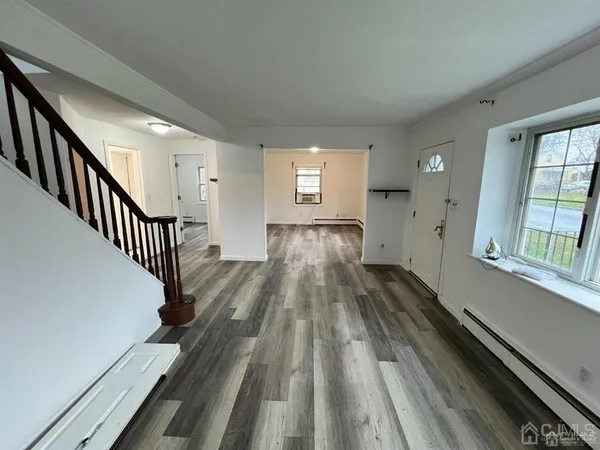 a view of gallery with wooden floor