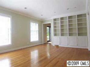 143 McAlway Road Charlotte, NC 28211 - Photo 5 of 8 an empty room with wooden floor and windows