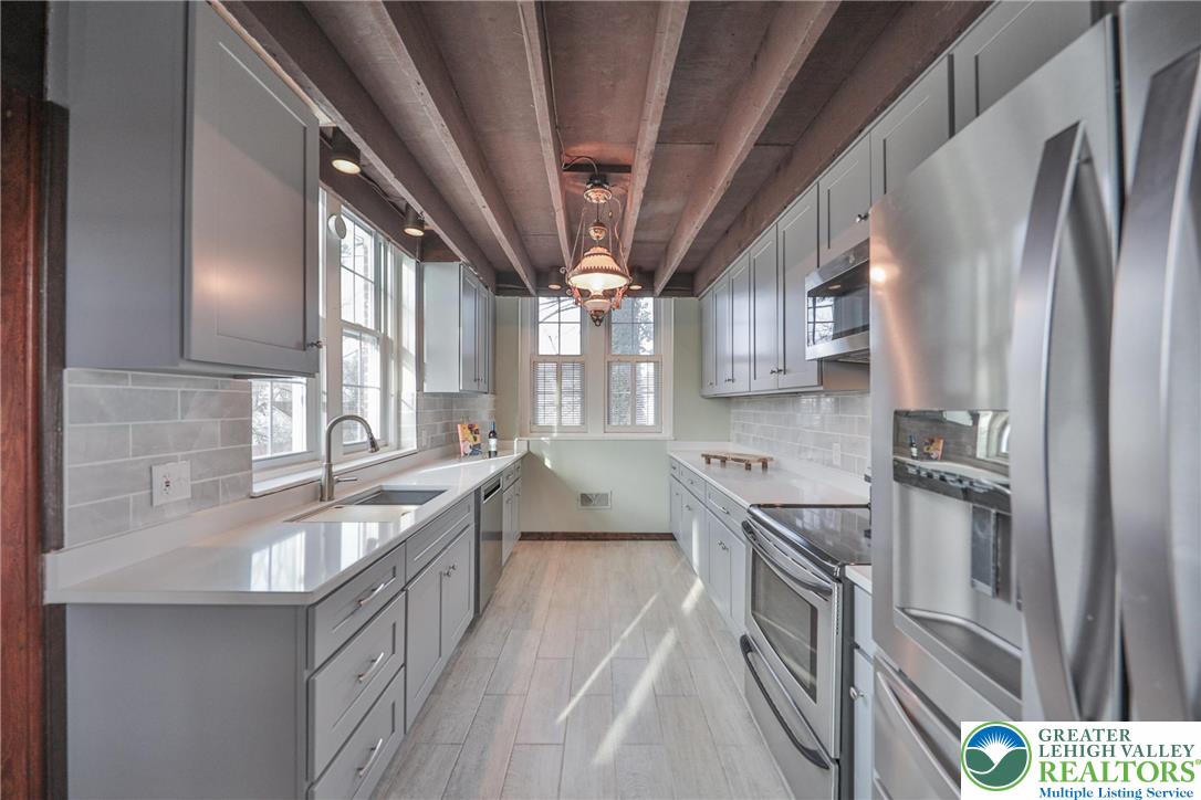 3285 Lime Street Bethlehem, PA 18020 - Photo 15 of 70 a large kitchen with stainless steel appliances granite countertop a lot of counter space and a sink