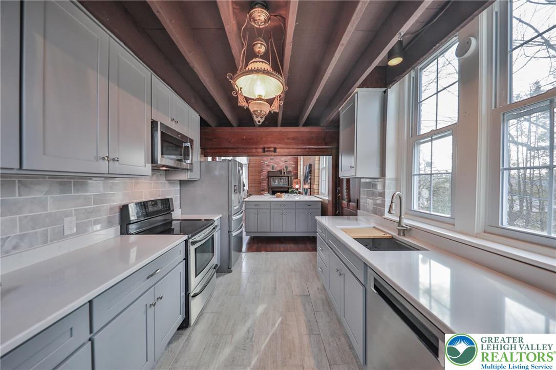 3285 Lime Street Bethlehem, PA 18020 - Photo 16 of 70 a kitchen with stainless steel appliances granite countertop a sink and a stove