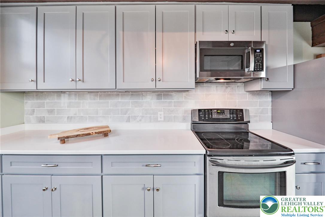 3285 Lime Street Bethlehem, PA 18020 - Photo 18 of 70 a kitchen with stainless steel appliances a stove a microwave and sink