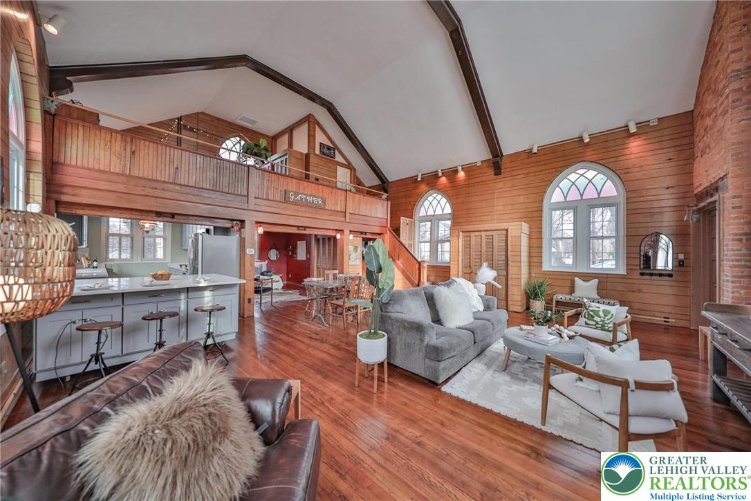 3285 Lime Street Bethlehem, PA 18020 - Photo 10 of 70 a living room with furniture a fireplace and a chandelier