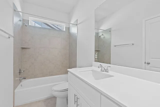 a bathroom with a sink a toilet and a bathtub