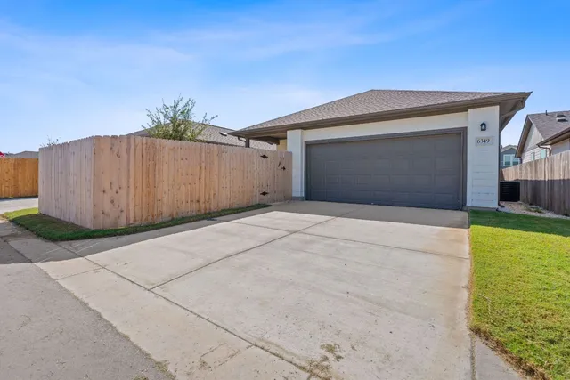 a front view of a house with a garage