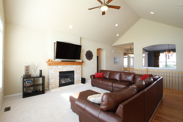 792 Ridgeview Lane Sugar Grove, IL 60554 - Photo 11 of 29 a living room with furniture a fireplace and a flat screen tv
