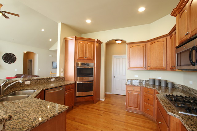 792 Ridgeview Lane Sugar Grove, IL 60554 - Photo 15 of 29 a kitchen with stainless steel appliances granite countertop a sink stove and refrigerator