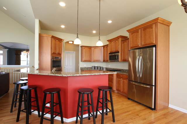 792 Ridgeview Lane Sugar Grove, IL 60554 - Photo 17 of 29 a kitchen with stainless steel appliances granite countertop a refrigerator a stove a sink dishwasher a dining table and chairs with wooden floor