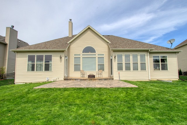 792 Ridgeview Lane Sugar Grove, IL 60554 - Photo 29 of 29 a front view of a house with a yard and brick wall
