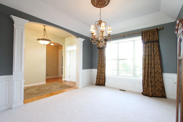 792 Ridgeview Lane Sugar Grove, IL 60554 - Photo 8 of 29 a view of a livingroom with a chandelier curtains and large windows