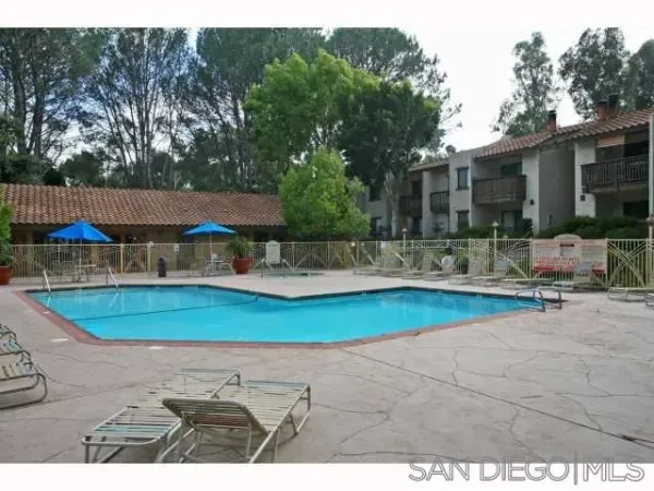 a view of a swimming pool with a patio