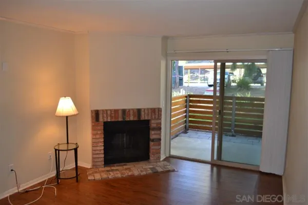a view of a livingroom with furniture and a fireplace