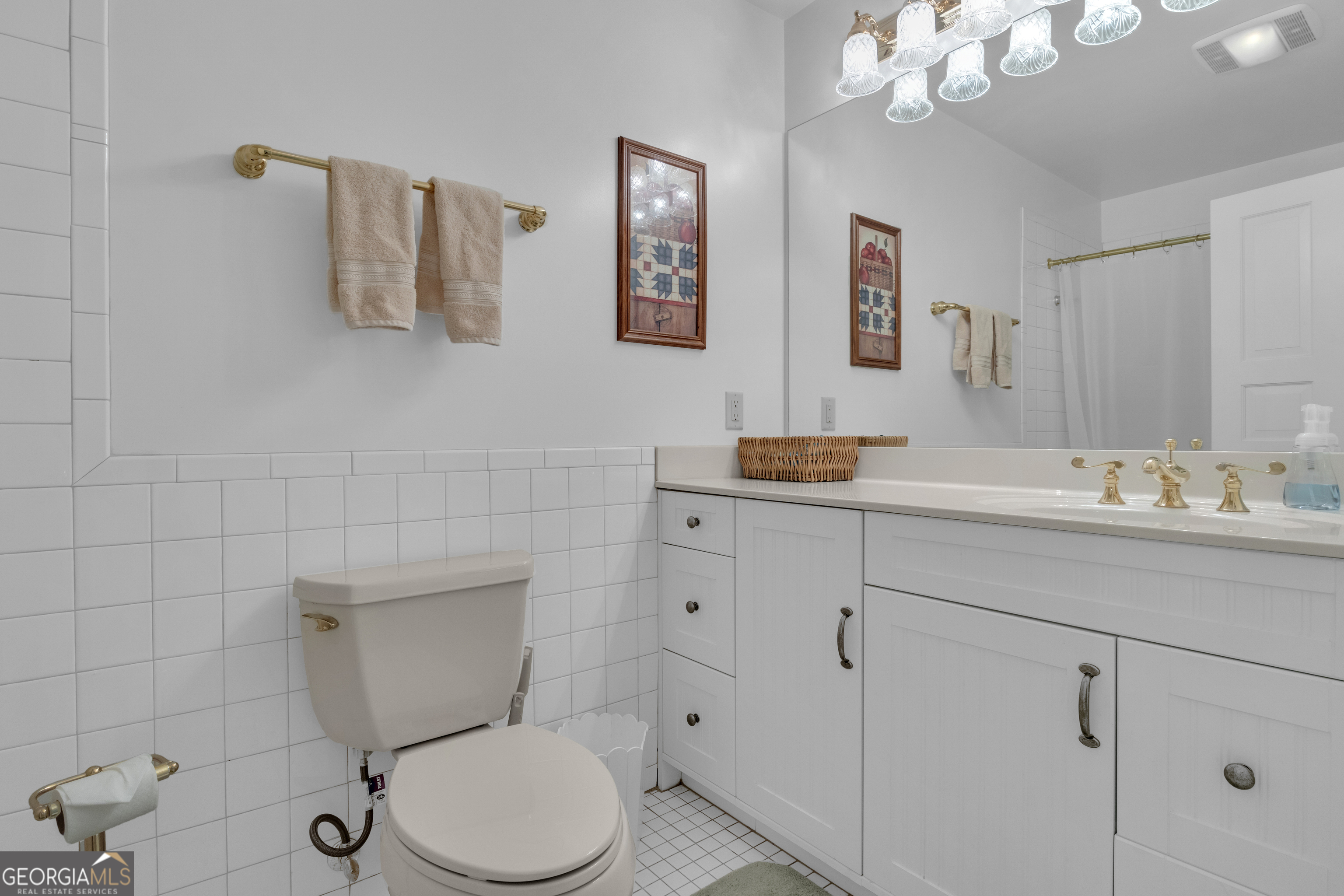 14803 Woolsey Road Hampton, GA 30228 - Photo 104 of 142 a bathroom with a granite countertop toilet sink and mirror