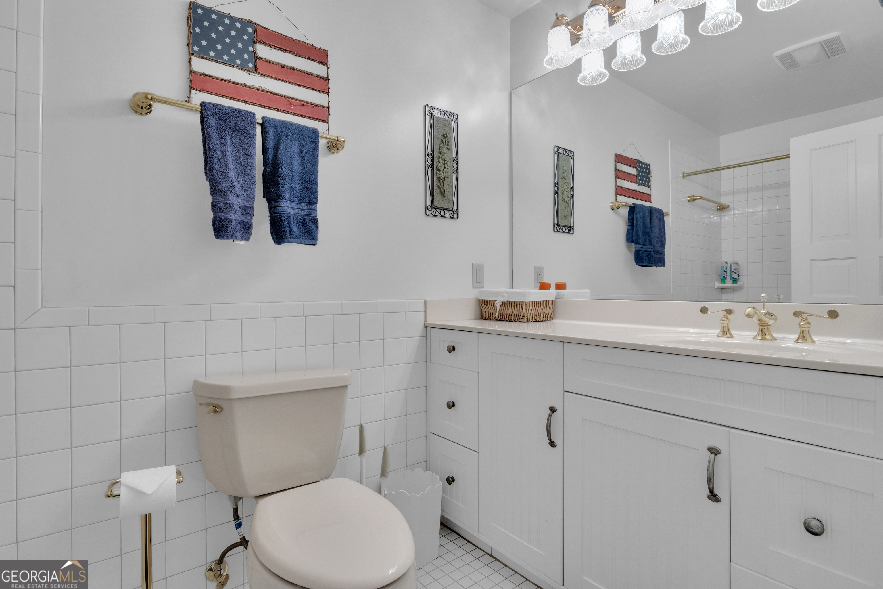 14803 Woolsey Road Hampton, GA 30228 - Photo 105 of 142 a bathroom with a toilet sink and mirror