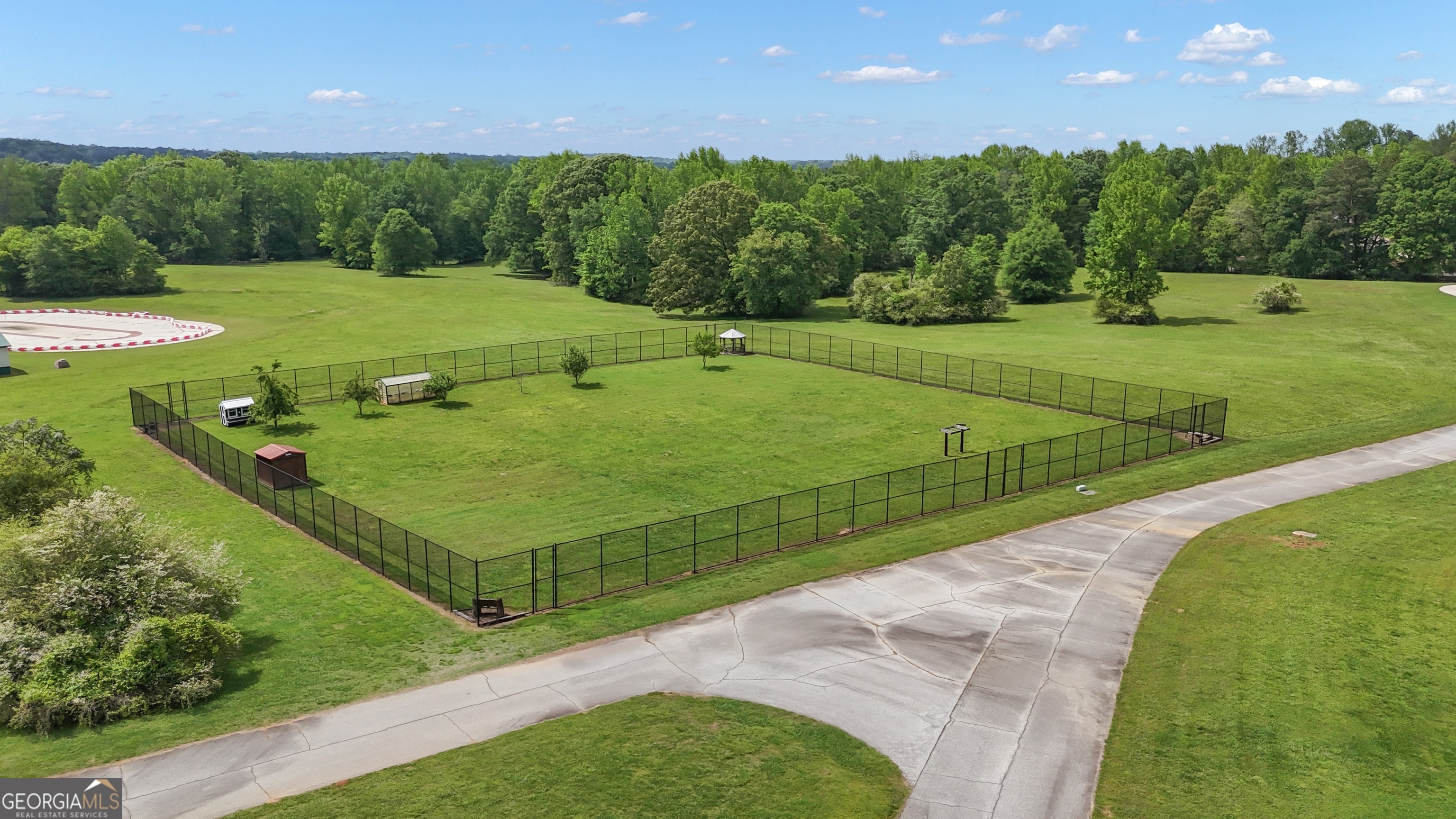 14803 Woolsey Road Hampton, GA 30228 - Photo 127 of 142 a view of a golf course with a outdoor space