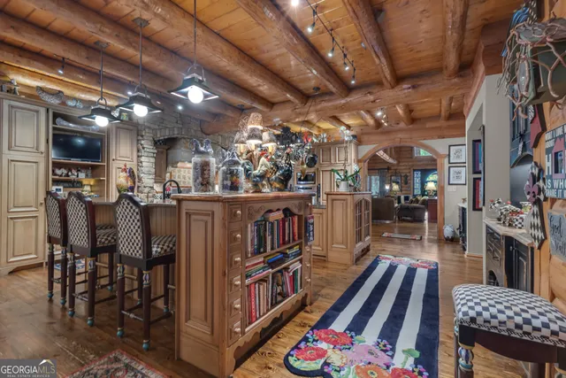 a kitchen with stainless steel appliances granite countertop a refrigerator stove and white cabinets