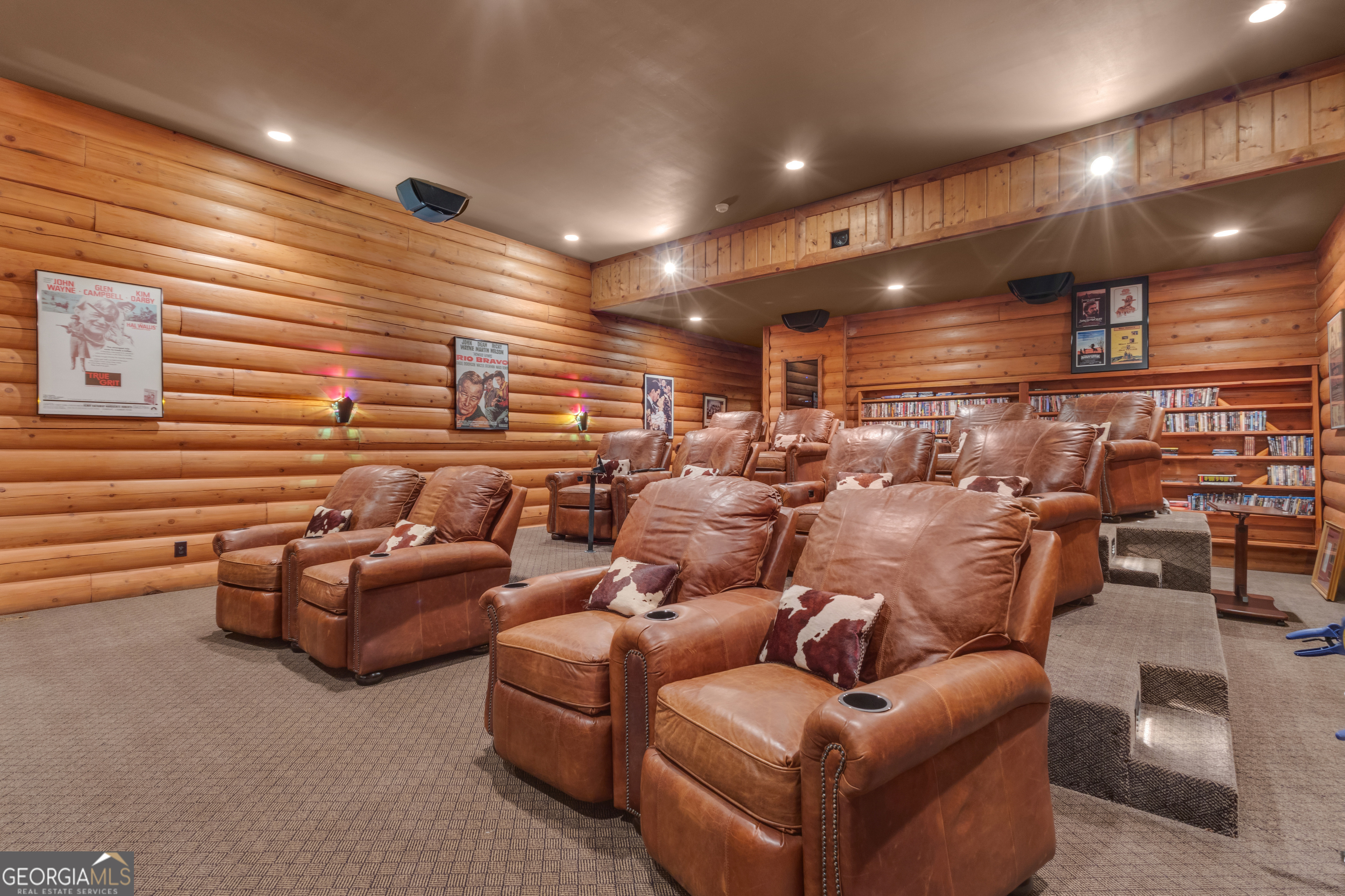 14803 Woolsey Road Hampton, GA 30228 - Photo 34 of 142 a media room with lots of chairs and a projector